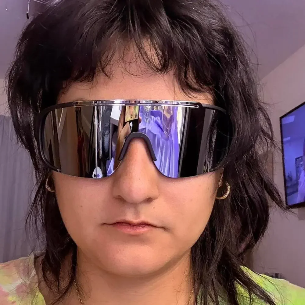 Unisex Black mirrored shield sunglasses with a sleek futuristic wraparound fit